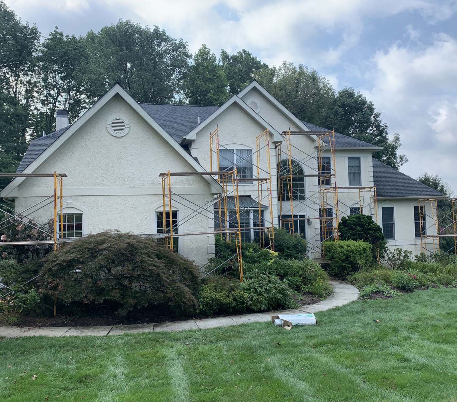 Photo of house before stucco replacement | time to replace home siding | Kenny Construction