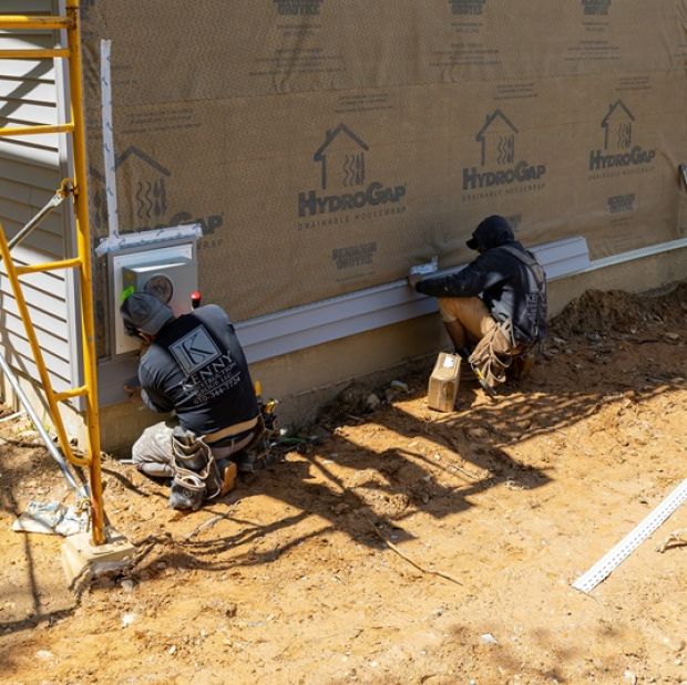 Workers doing construction on house | Home Building Services | Kenny Construction Group